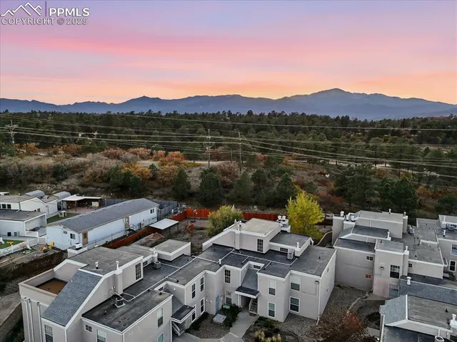 an aerial view of a house with a lake view