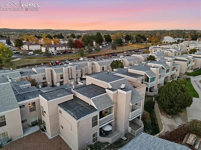 a view of a house with a mountain in the background