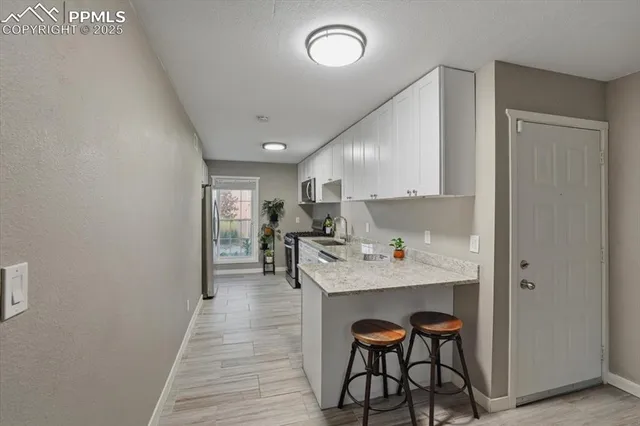 a kitchen with a sink cabinets and counter space