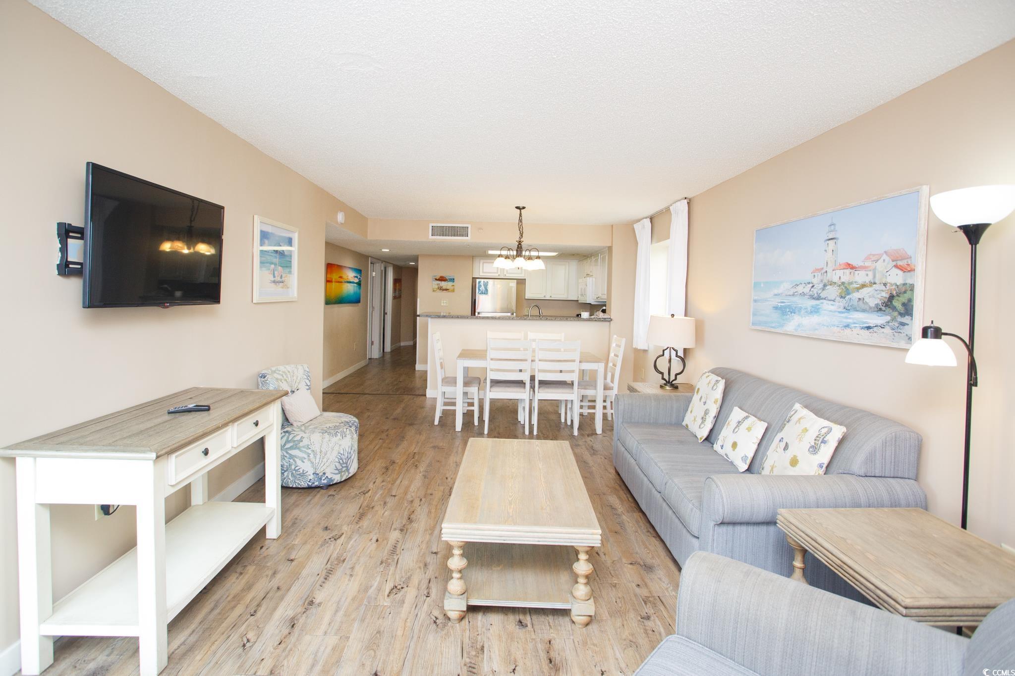 201 74th Avenue North, Unit 1401 Myrtle Beach, SC 29572 - Photo 11 of 32 Living area with light wood-style flooring and a c