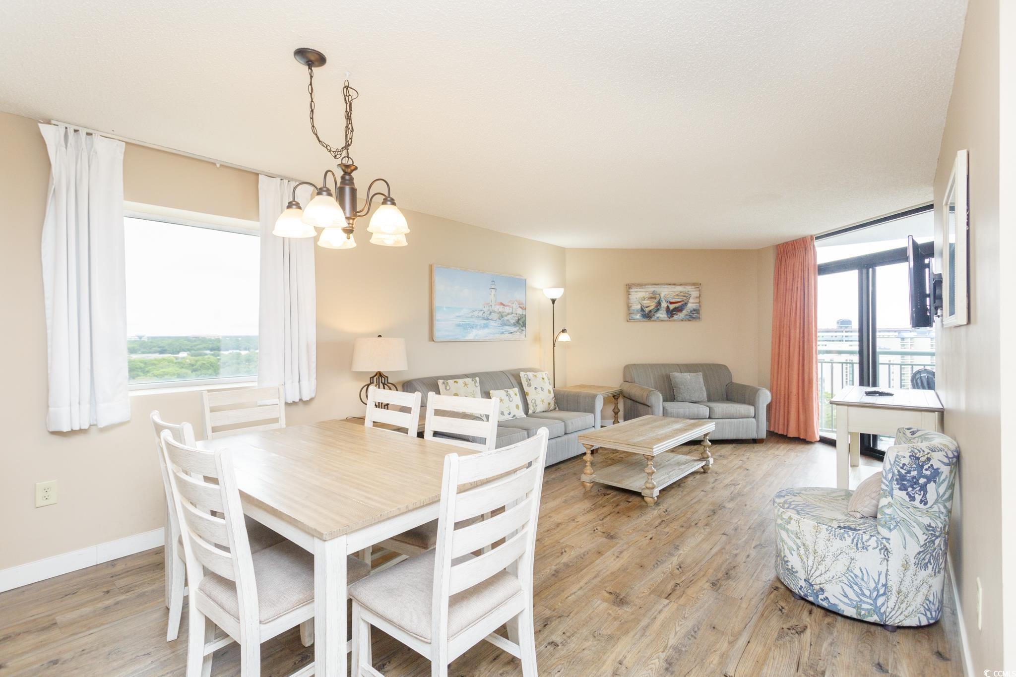 201 74th Avenue North, Unit 1401 Myrtle Beach, SC 29572 - Photo 13 of 32 Dining area with light wood-type flooring and a ch