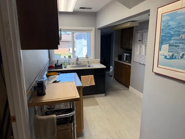 a kitchen with a stove and a refrigerator