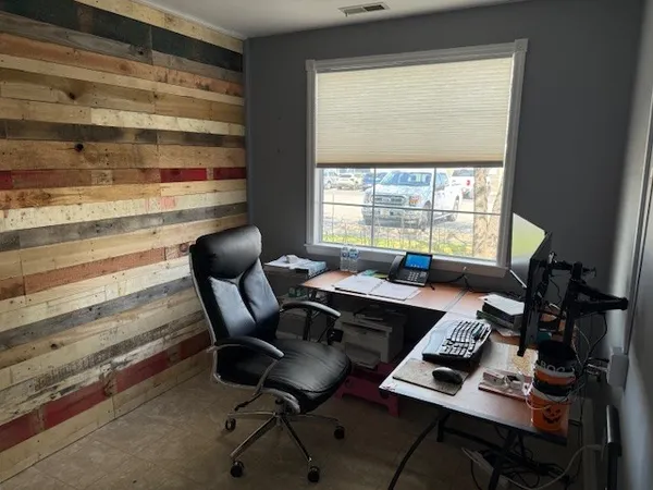 a workspace with furniture and a window
