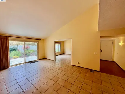 a kitchen with stainless steel appliances granite countertop a refrigerator and a stove