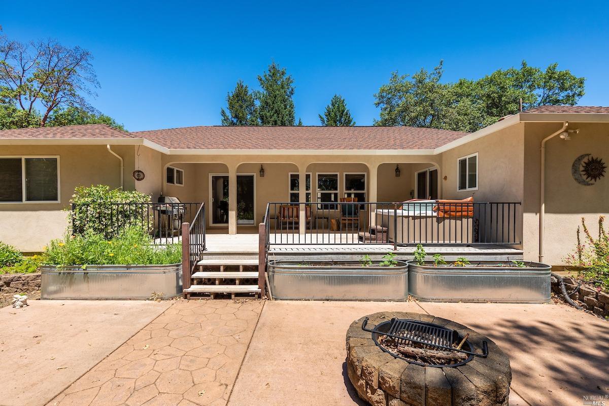 2371 Rancheria Road Redwood Valley, CA 95470 - Photo 1 of 1 a view of a house with backyard and sitting area