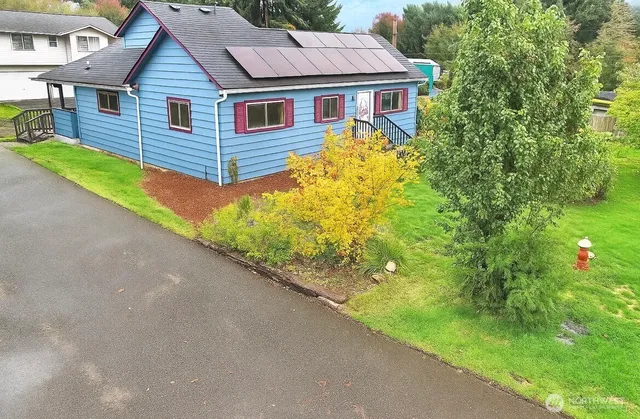 a front view of a house with garden