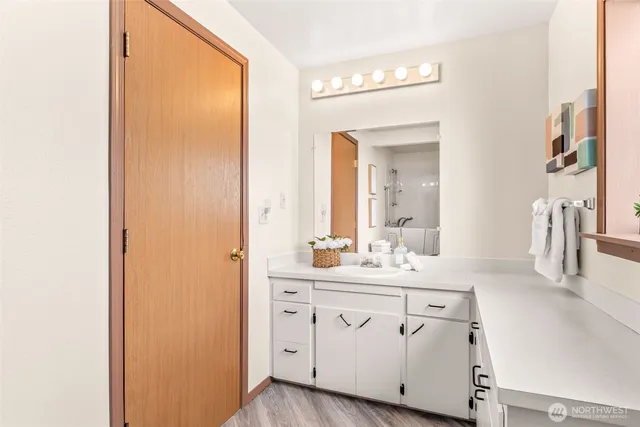 a spacious bedroom with a bed and a couch