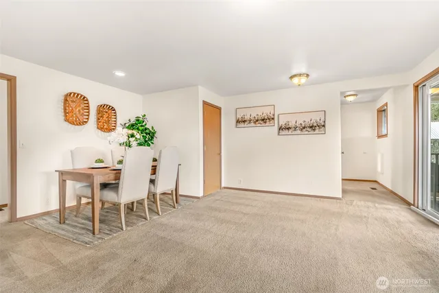 a living room with furniture and a table