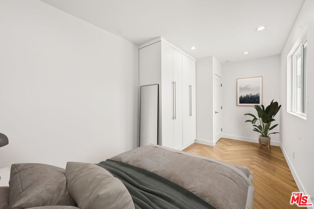 6327 Babcock Avenue Valley Glen, CA 91606 - Photo 14 of 21 a bedroom with a bed and a couch