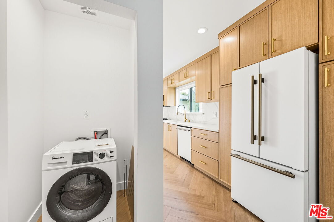 6327 Babcock Avenue Valley Glen, CA 91606 - Photo 19 of 21 a kitchen with a refrigerator a washer and dryer