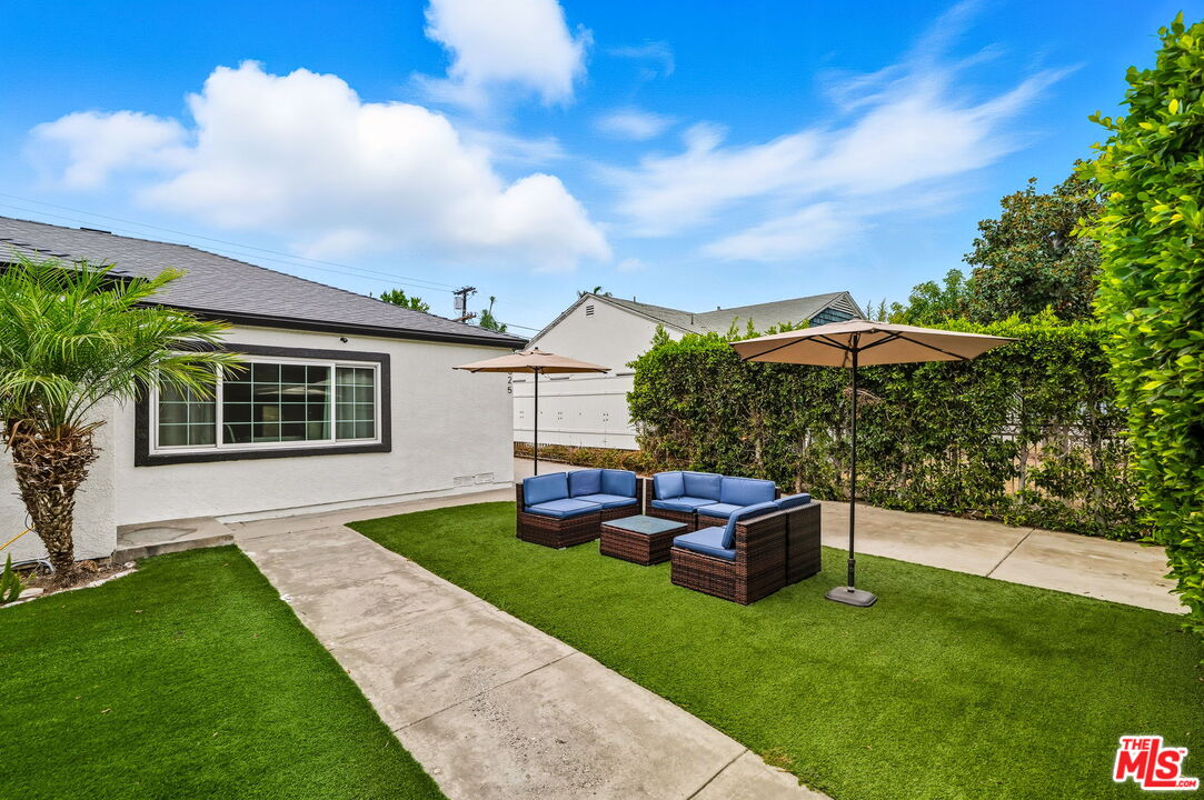 6327 Babcock Avenue Valley Glen, CA 91606 - Photo 2 of 21 a view of a house with backyard sitting area and garden