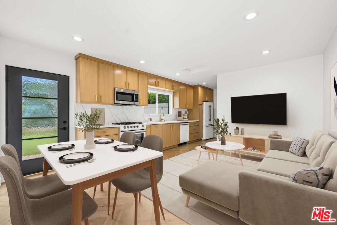 6327 Babcock Avenue Valley Glen, CA 91606 - Photo 7 of 21 a living room with furniture wooden floor and a flat screen tv