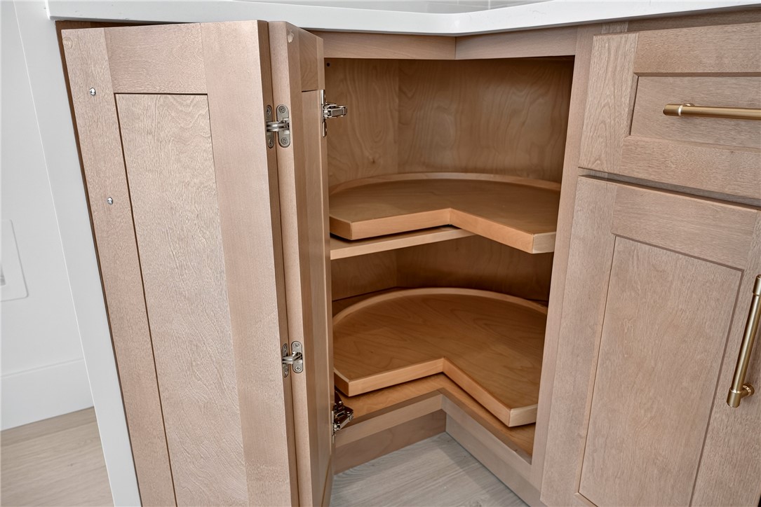 414 Blume Road Anderson, SC 29625 - Photo 28 of 50 Functional corner cabinetry includes built-in rotating wooden shelves maximizing kitchen organization.