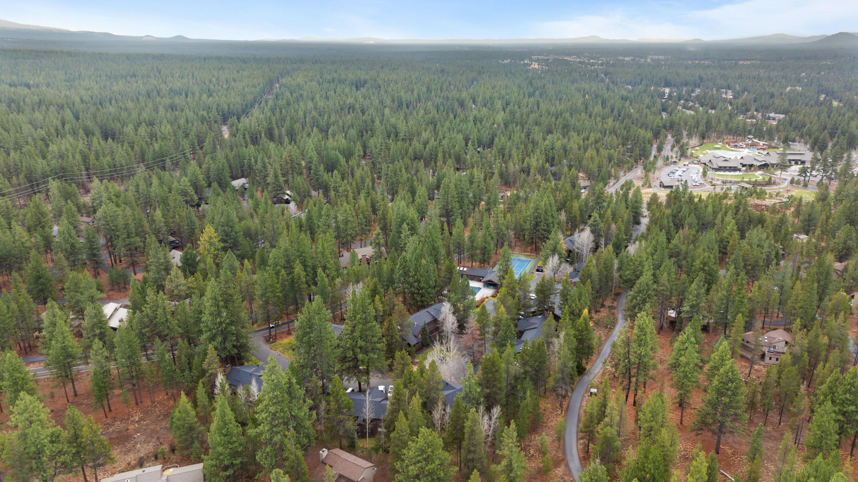 57376 Beaver Ridge Loop, Unit 33C1 Sunriver, OR 97707 - Photo 35 of 35 a view of a city with lush green forest