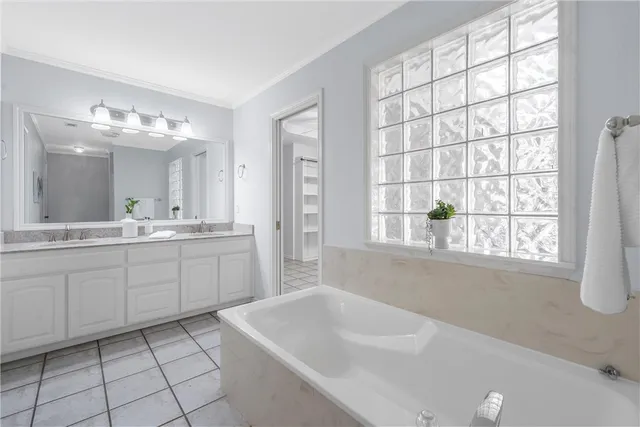 a spacious bathroom with a sink and a bathtub