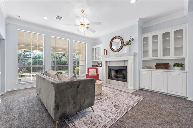 a living room with furniture and a fireplace