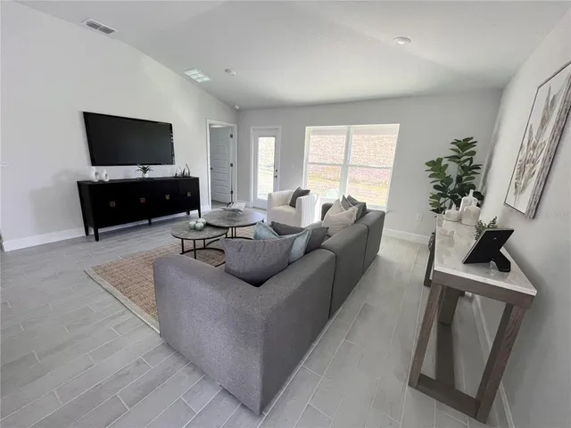 a bathroom with a granite countertop sink a mirror and a shower