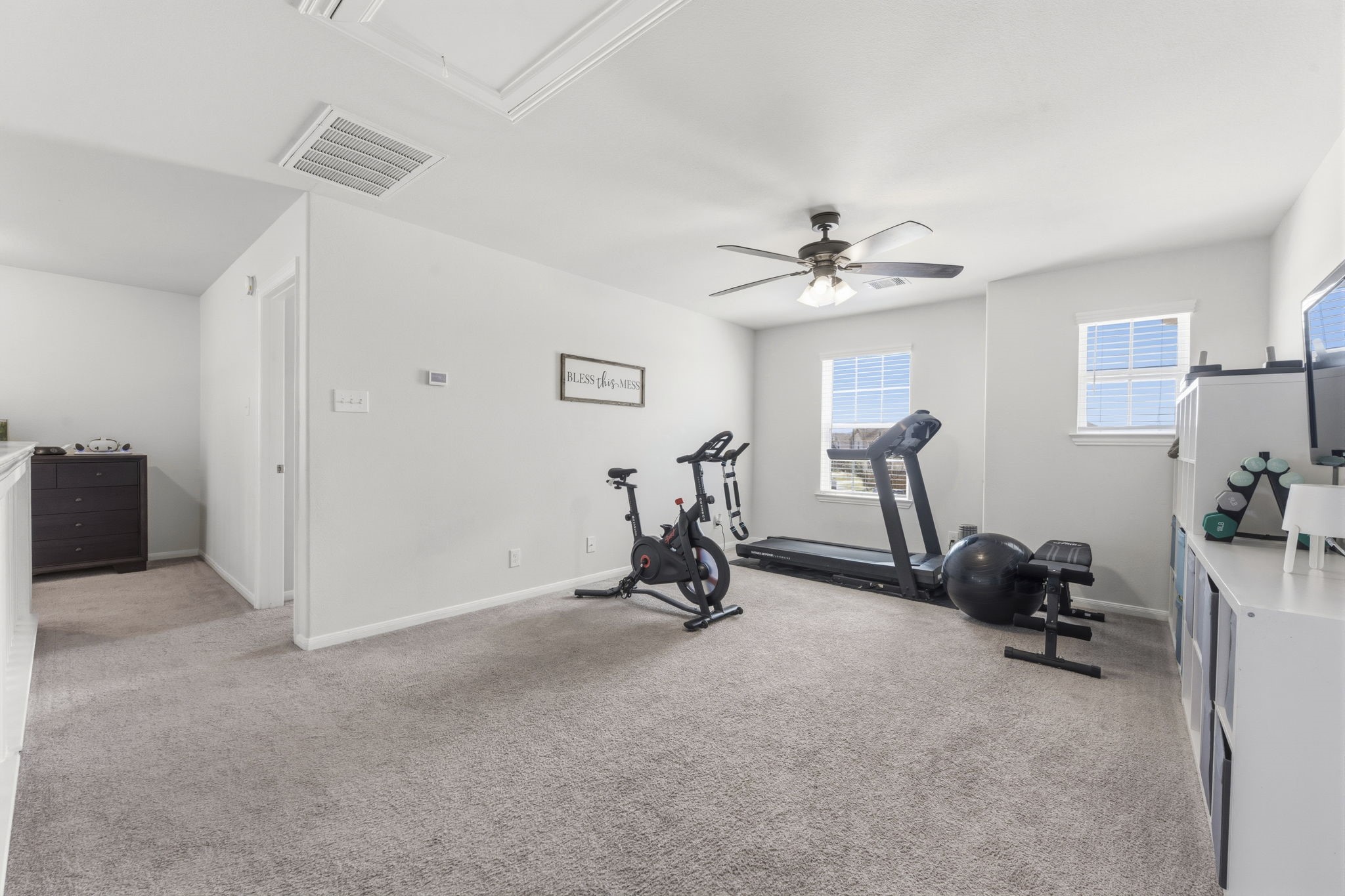 2401 Abbot Brk Drive Rosharon, TX 77583 - Photo 27 of 50 The possibilities for this room are endless! It could be used as a game room, playroom, or party room, or second office! Features include lush carpeting, two sunny windows with 2” blinds, and lighted ceiling fan.