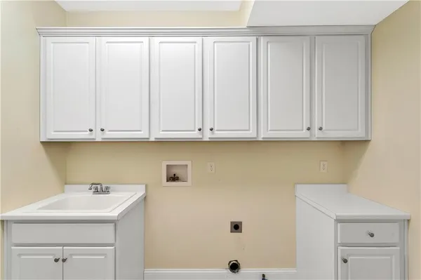 a view of cabinets with sink