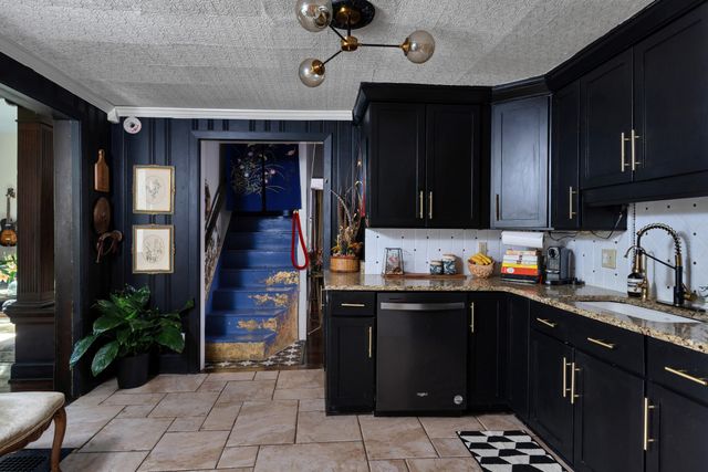 a kitchen with a sink and cabinets