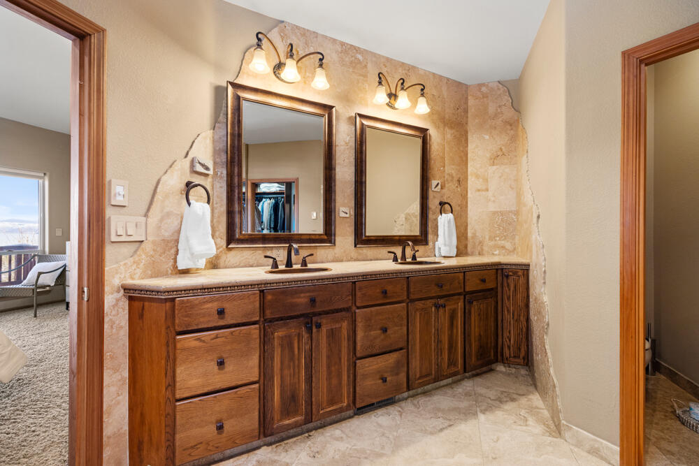 11147 Kestrel Road Klamath Falls, OR 97601 - Photo 29 of 66 Travertine floors and wall plus double vanity with copper sinks.