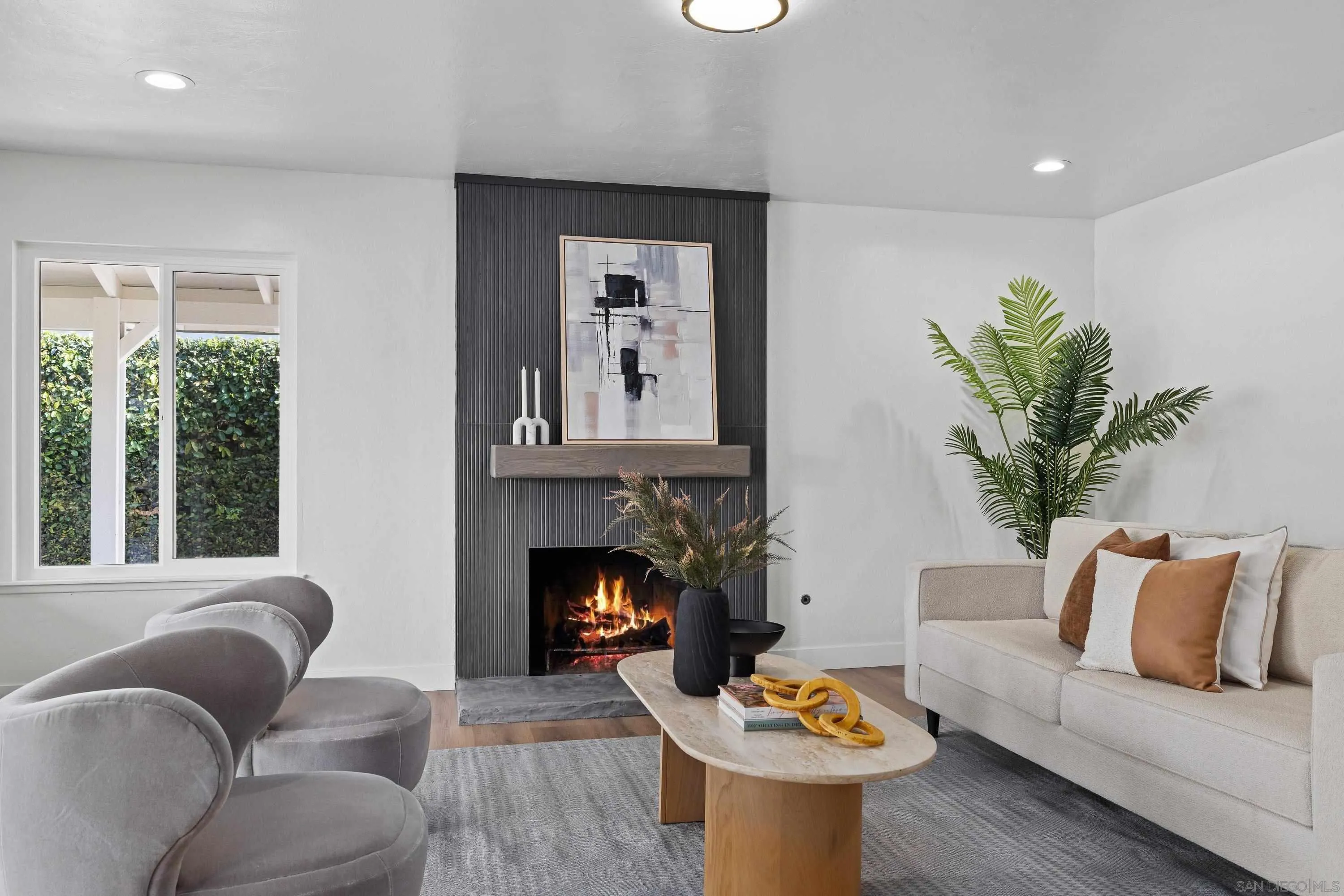 4422 Point Degada Oceanside, CA 92058 - Photo 15 of 57 a living room with furniture and a fireplace