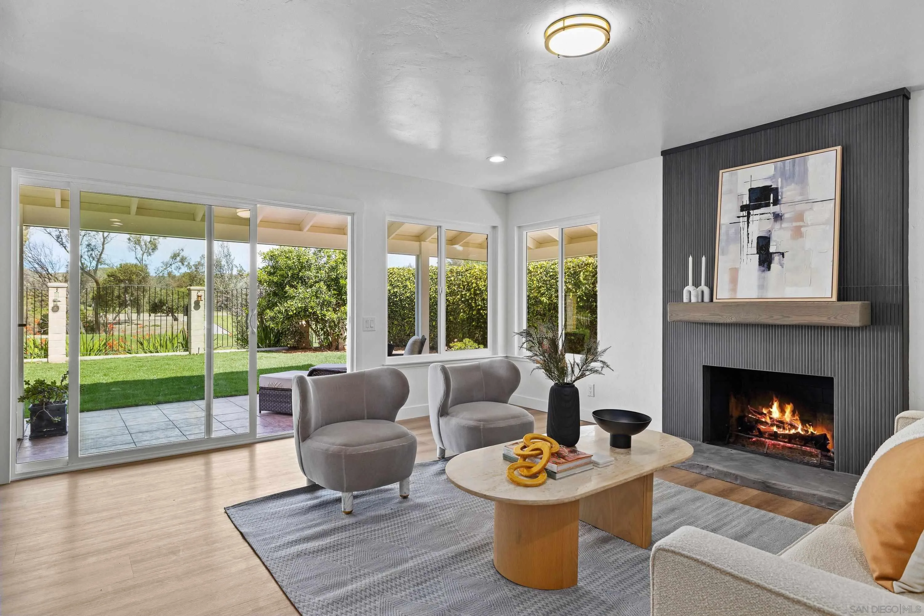 4422 Point Degada Oceanside, CA 92058 - Photo 16 of 57 a living room with furniture and a fireplace