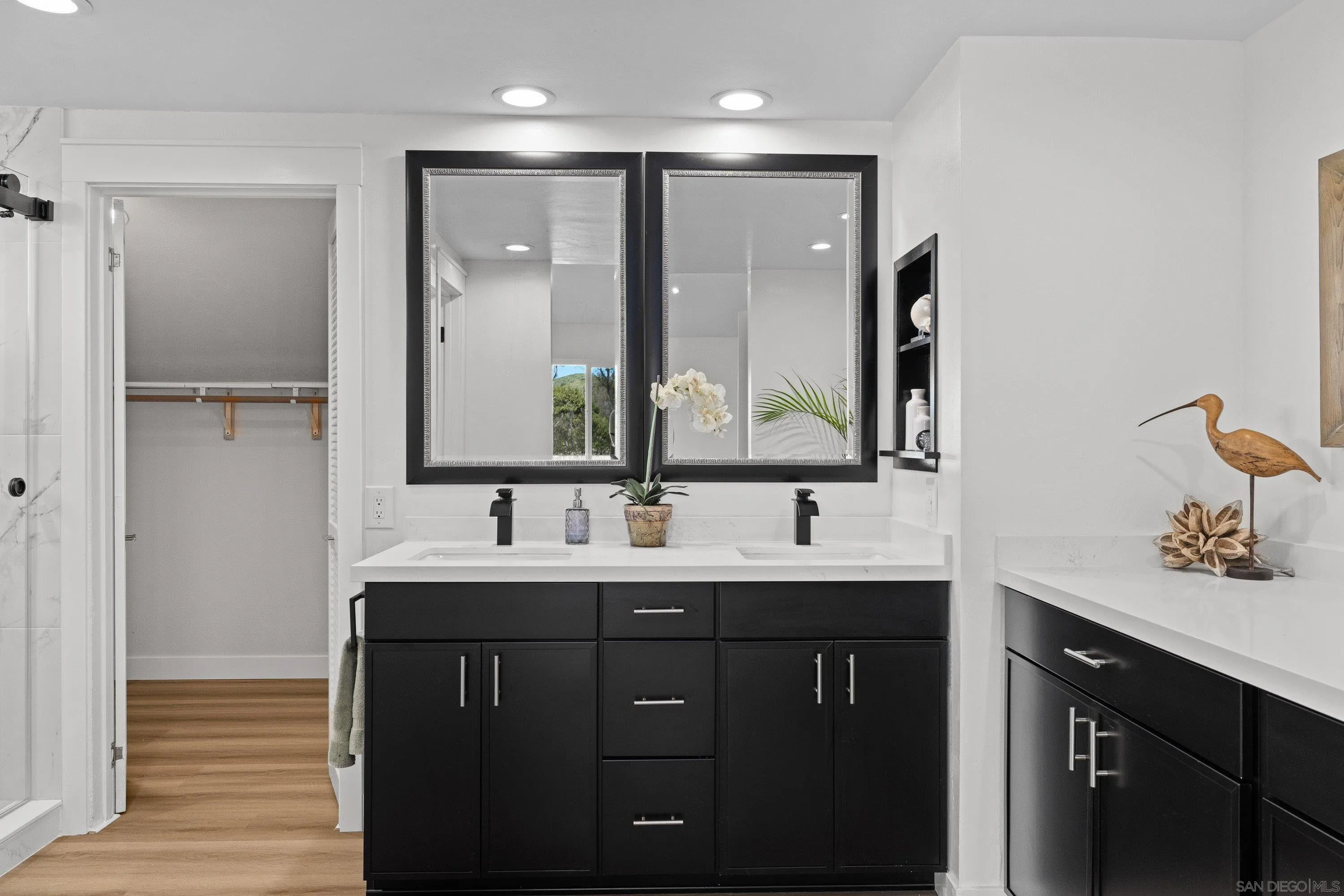4422 Point Degada Oceanside, CA 92058 - Photo 25 of 57 a bathroom with a double vanity sink and mirror