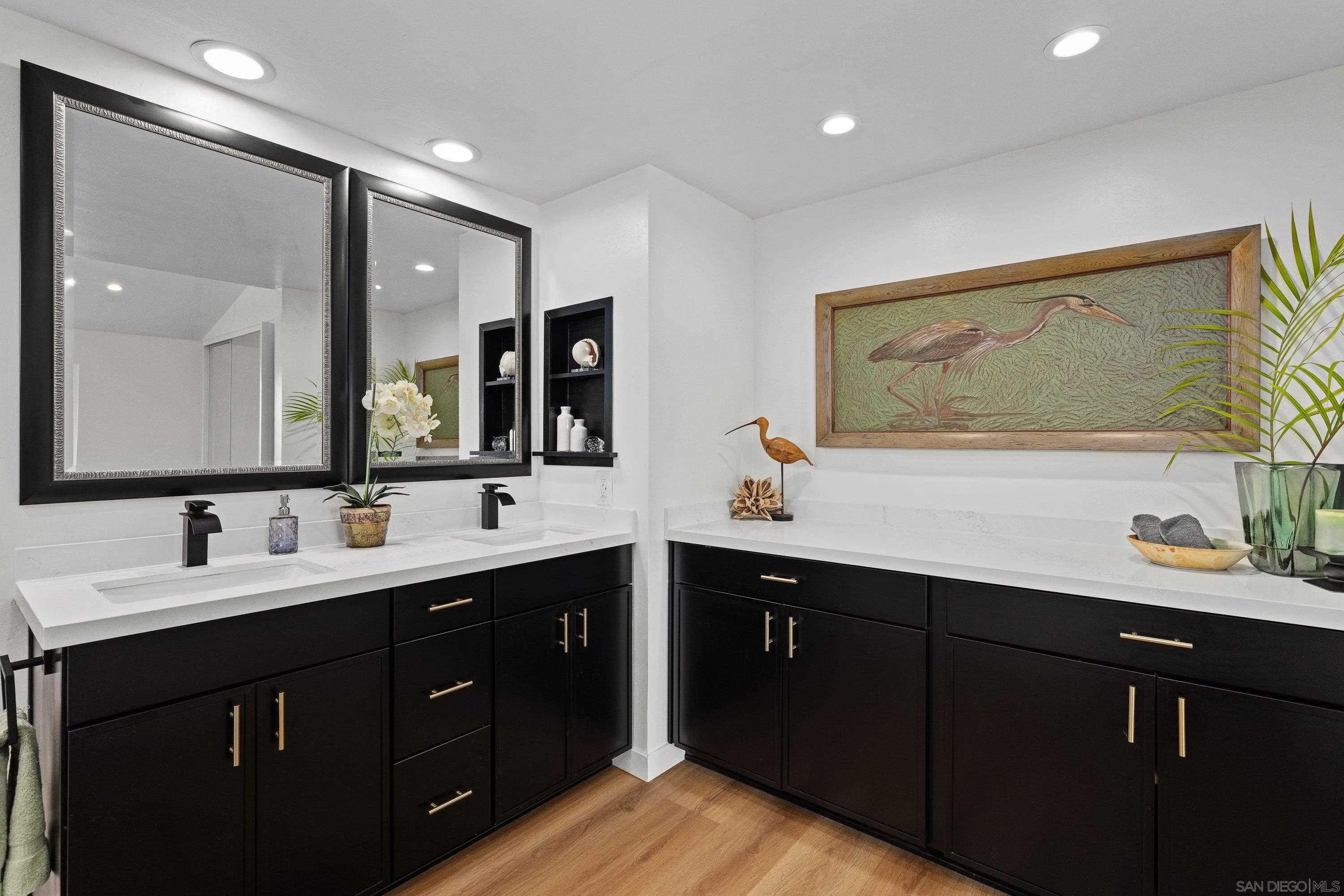 4422 Point Degada Oceanside, CA 92058 - Photo 26 of 57 a bathroom with a double vanity sink and a mirror