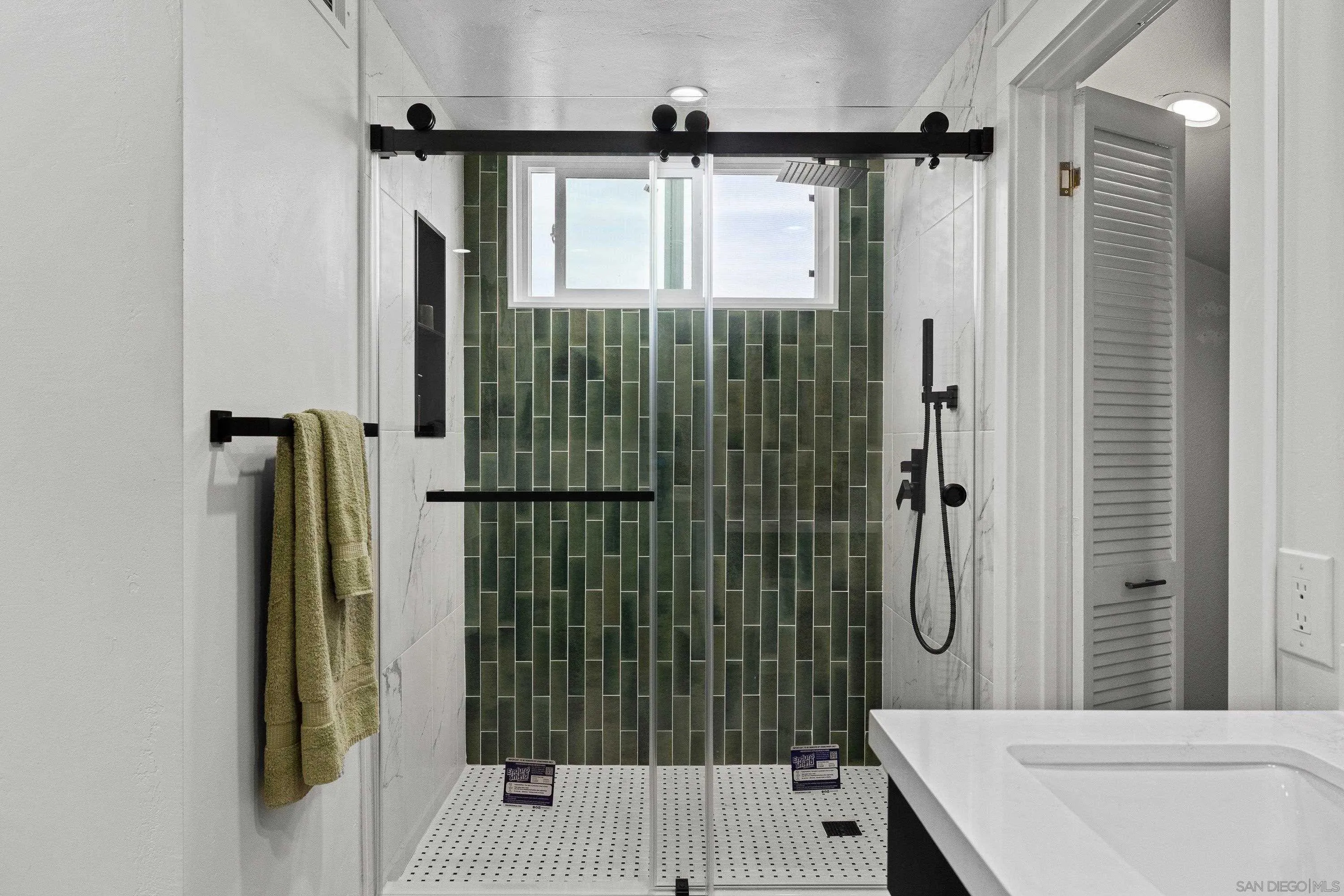4422 Point Degada Oceanside, CA 92058 - Photo 27 of 57 a bathroom with a shower and a sink