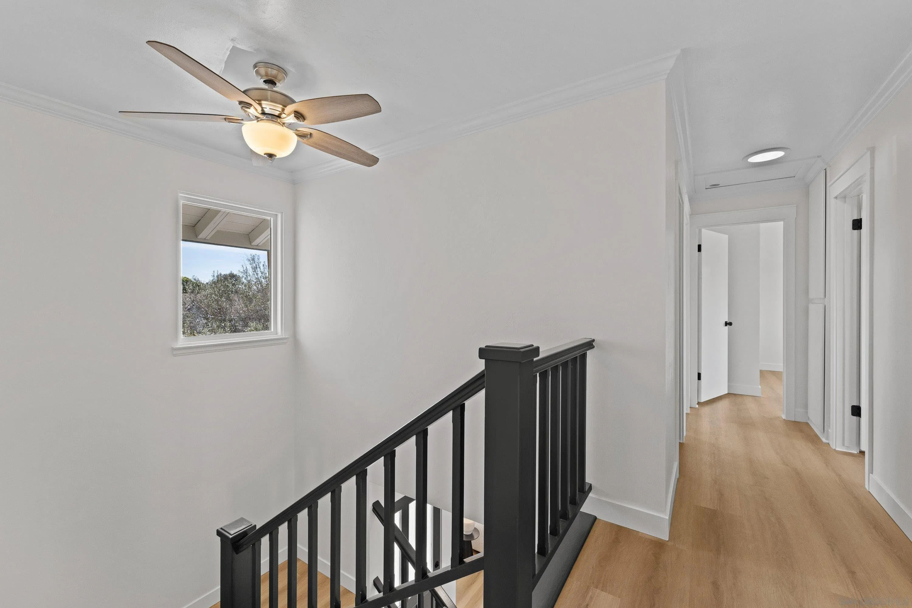 4422 Point Degada Oceanside, CA 92058 - Photo 31 of 57 a view of a hallway with wooden floor