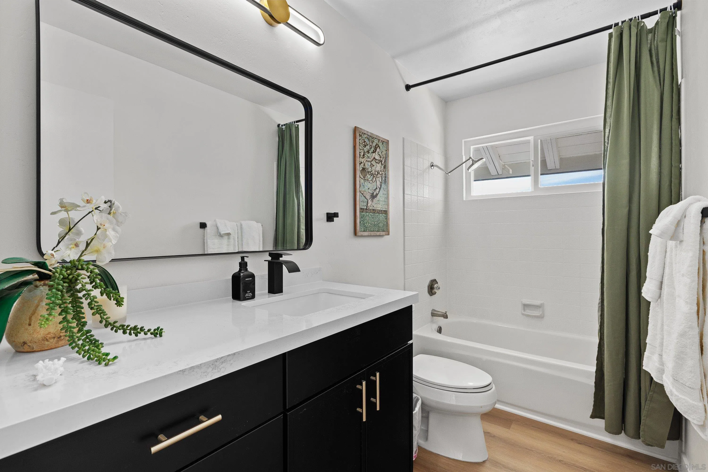 4422 Point Degada Oceanside, CA 92058 - Photo 32 of 57 a bathroom with a granite countertop sink a toilet a mirror a vanity and shower