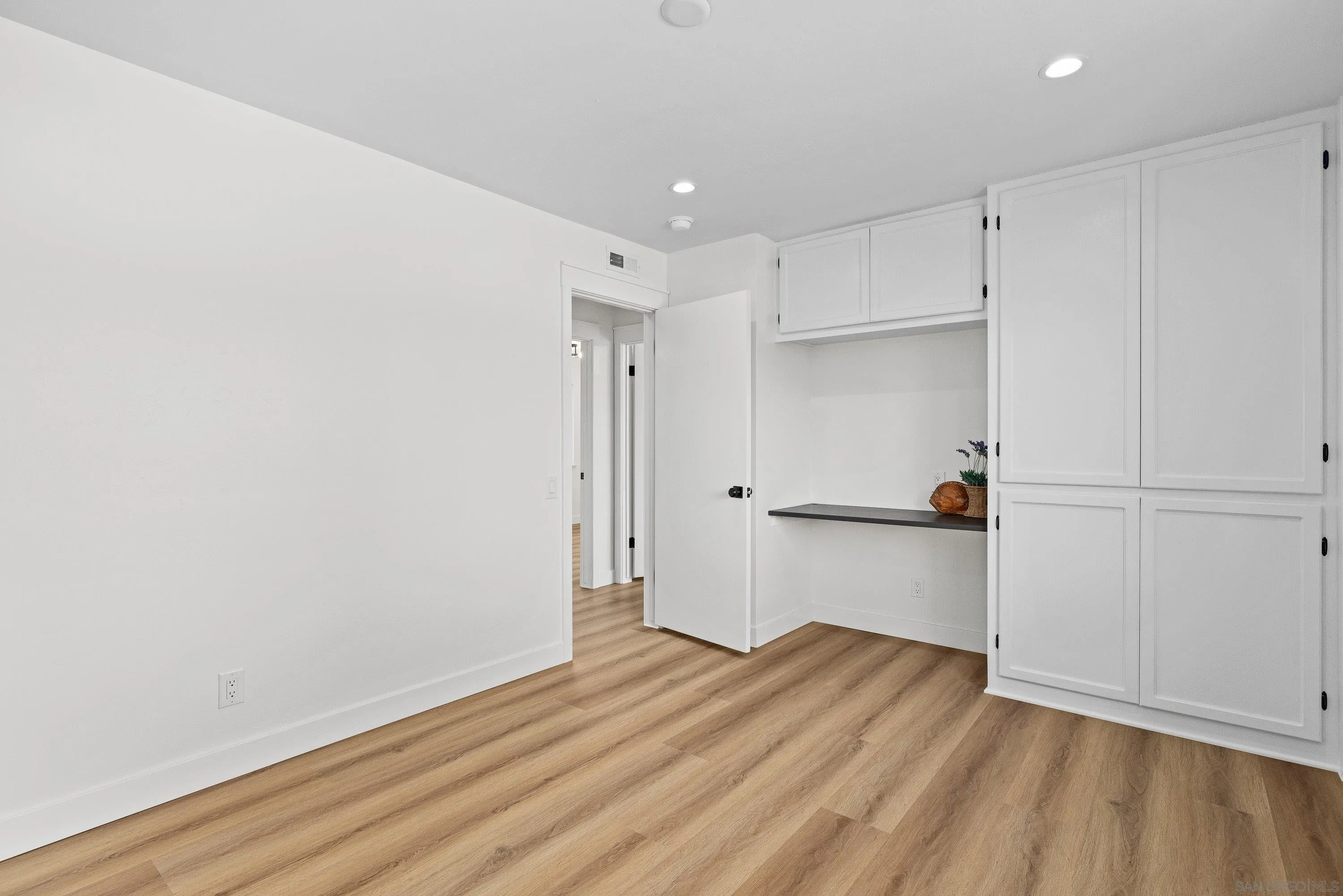 4422 Point Degada Oceanside, CA 92058 - Photo 38 of 57 a view of an empty room with wooden floor