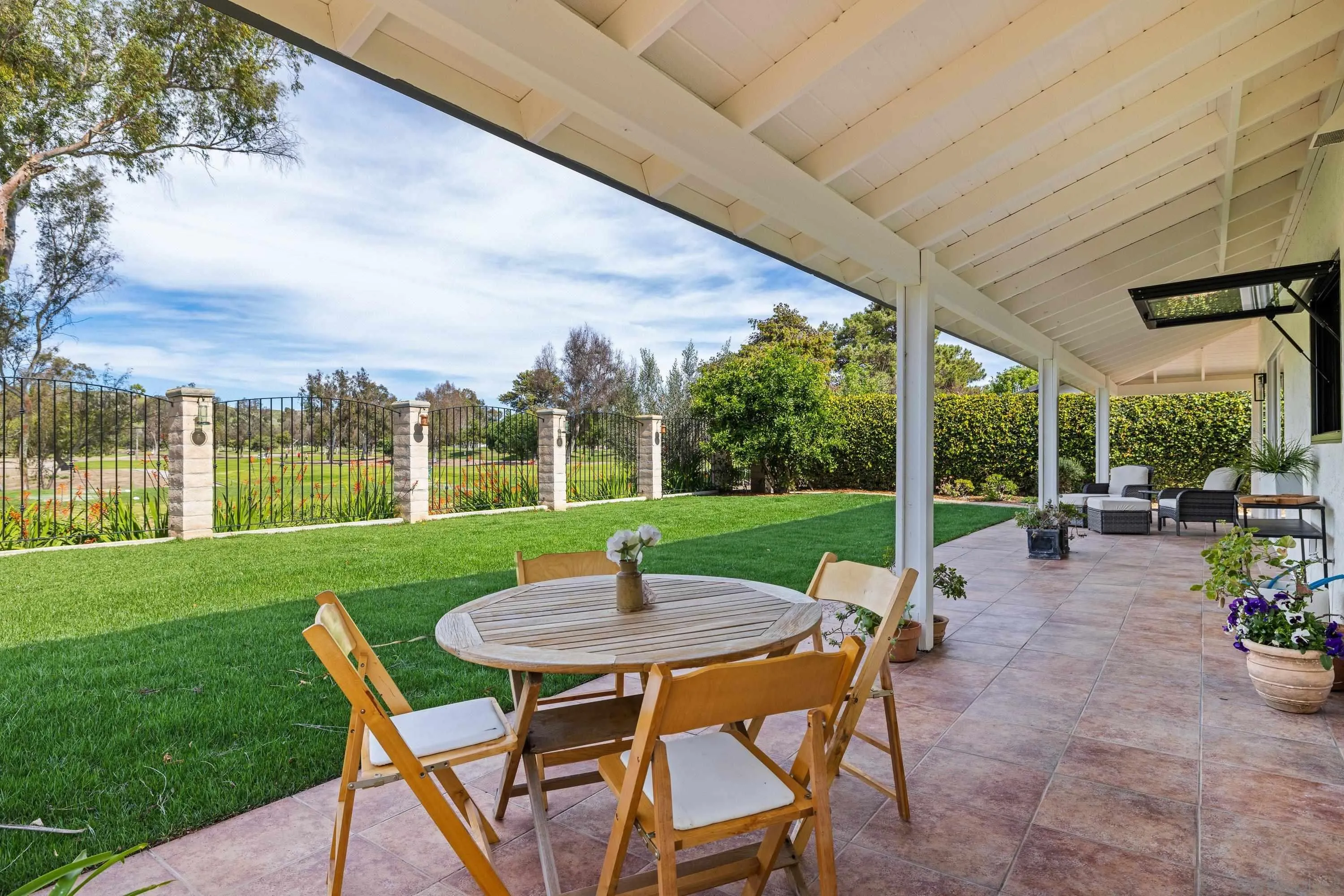 4422 Point Degada Oceanside, CA 92058 - Photo 39 of 57 a view of a patio with a table chairs and a backyard