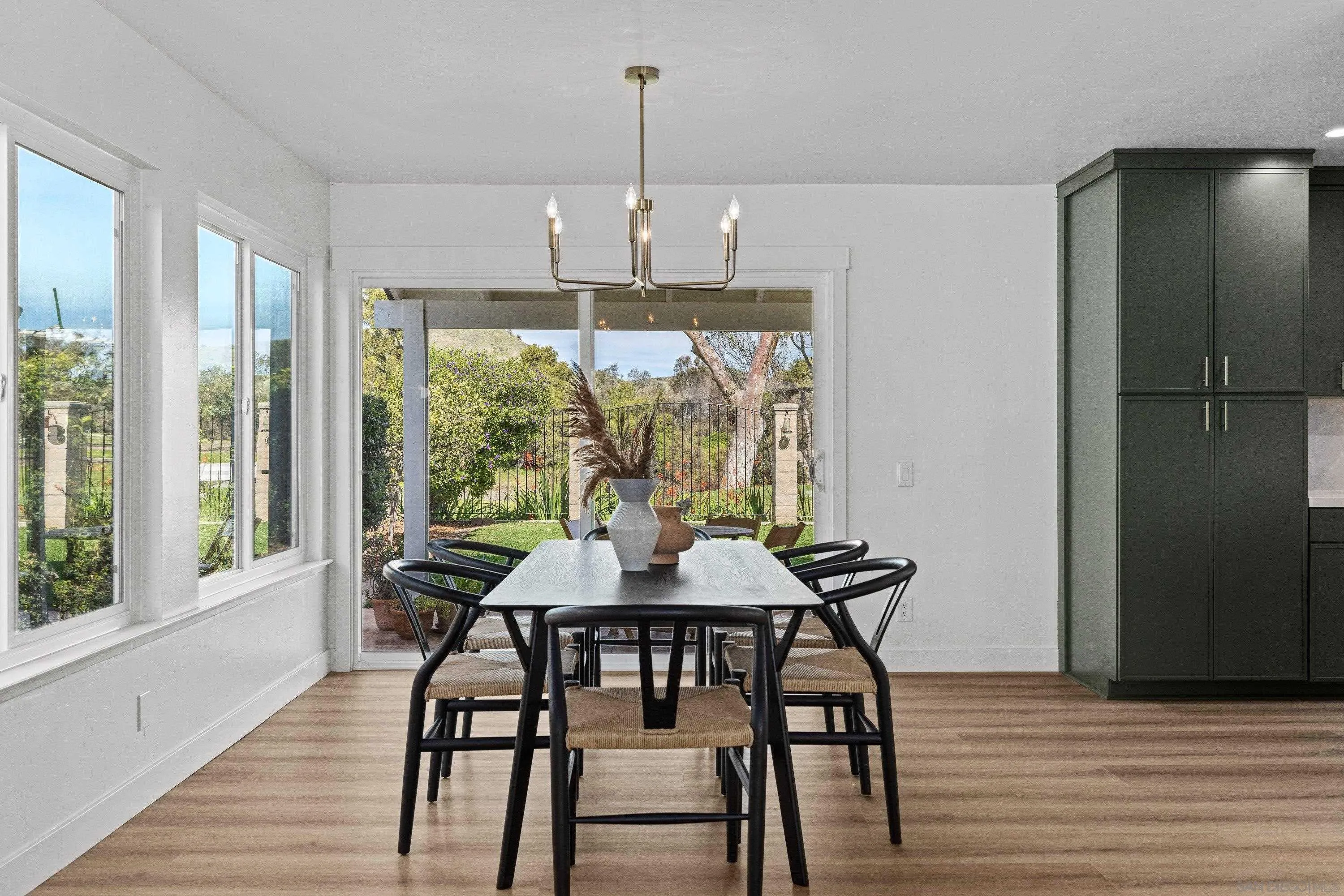 4422 Point Degada Oceanside, CA 92058 - Photo 8 of 57 a view of a dining room with furniture window and wooden floor