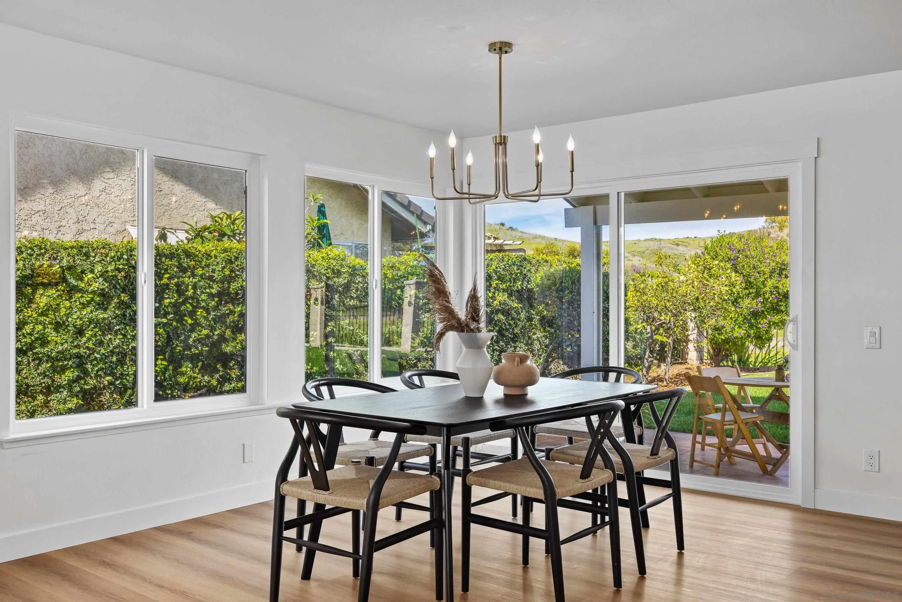 4422 Point Degada Oceanside, CA 92058 - Photo 9 of 57 a view of a dining room with furniture window and wooden floor
