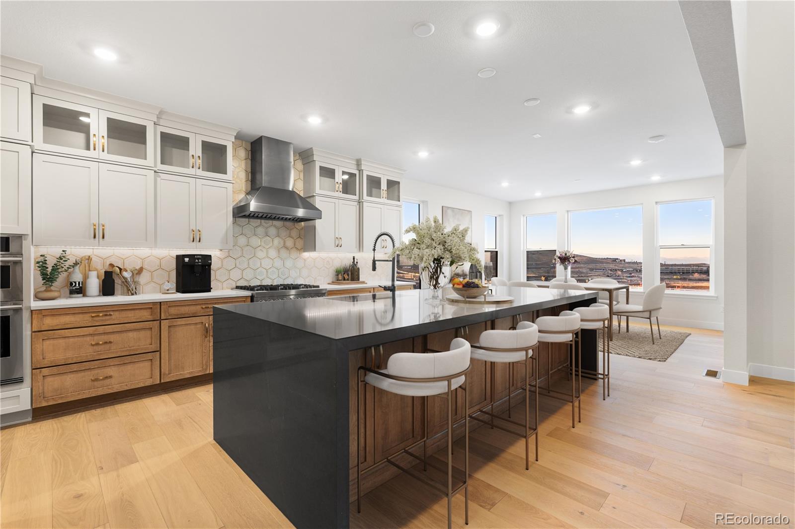 11283 Tenor Trail Lone Tree, CO 80134 - Photo 18 of 47 a kitchen with counter space cabinets a sink and appliances