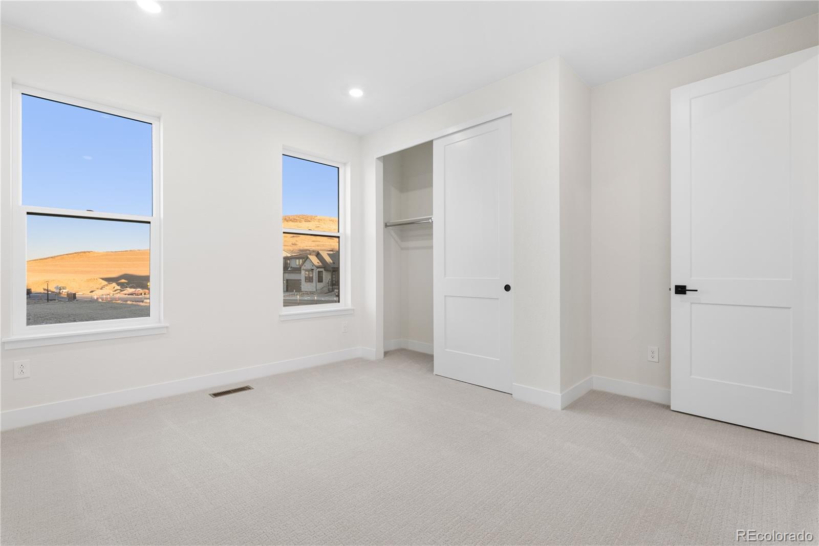 11283 Tenor Trail Lone Tree, CO 80134 - Photo 25 of 47 an empty room with windows