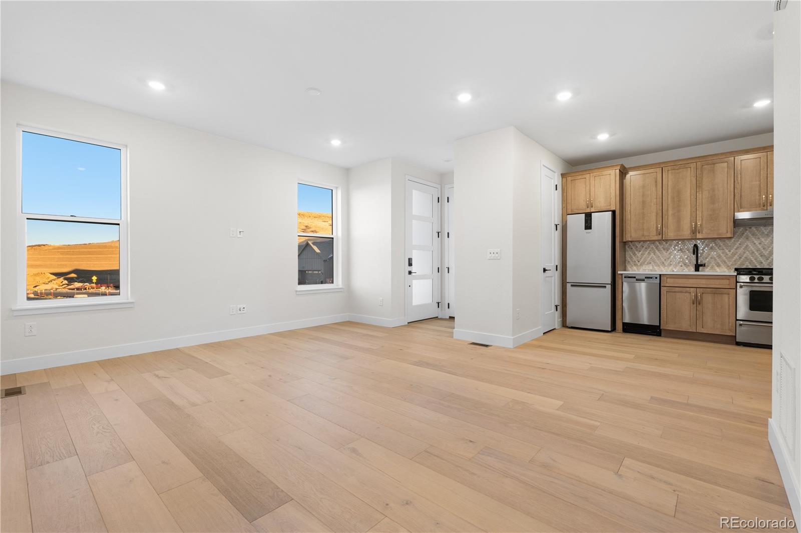 11283 Tenor Trail Lone Tree, CO 80134 - Photo 27 of 47 a view of an empty room with a kitchen