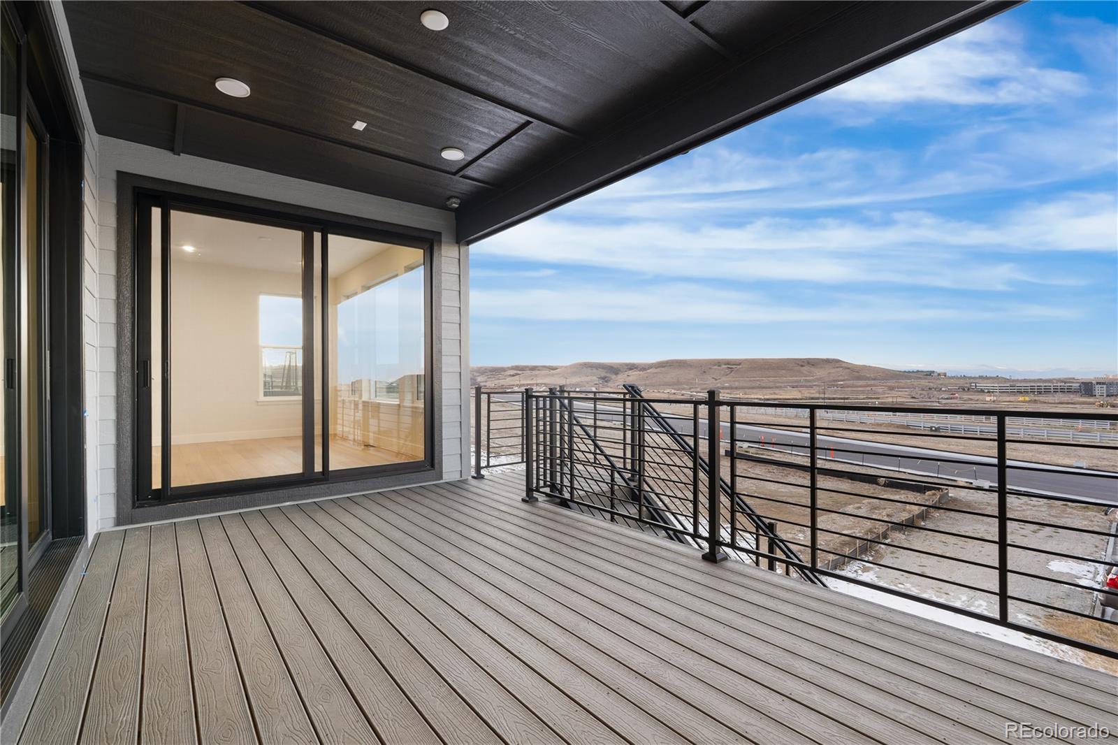 11283 Tenor Trail Lone Tree, CO 80134 - Photo 3 of 47 a view of balcony with wooden floor