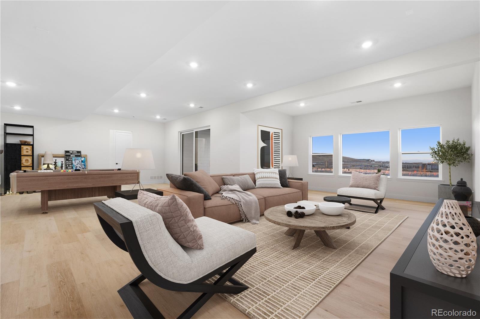 11283 Tenor Trail Lone Tree, CO 80134 - Photo 6 of 47 a living room with furniture and a wooden floor
