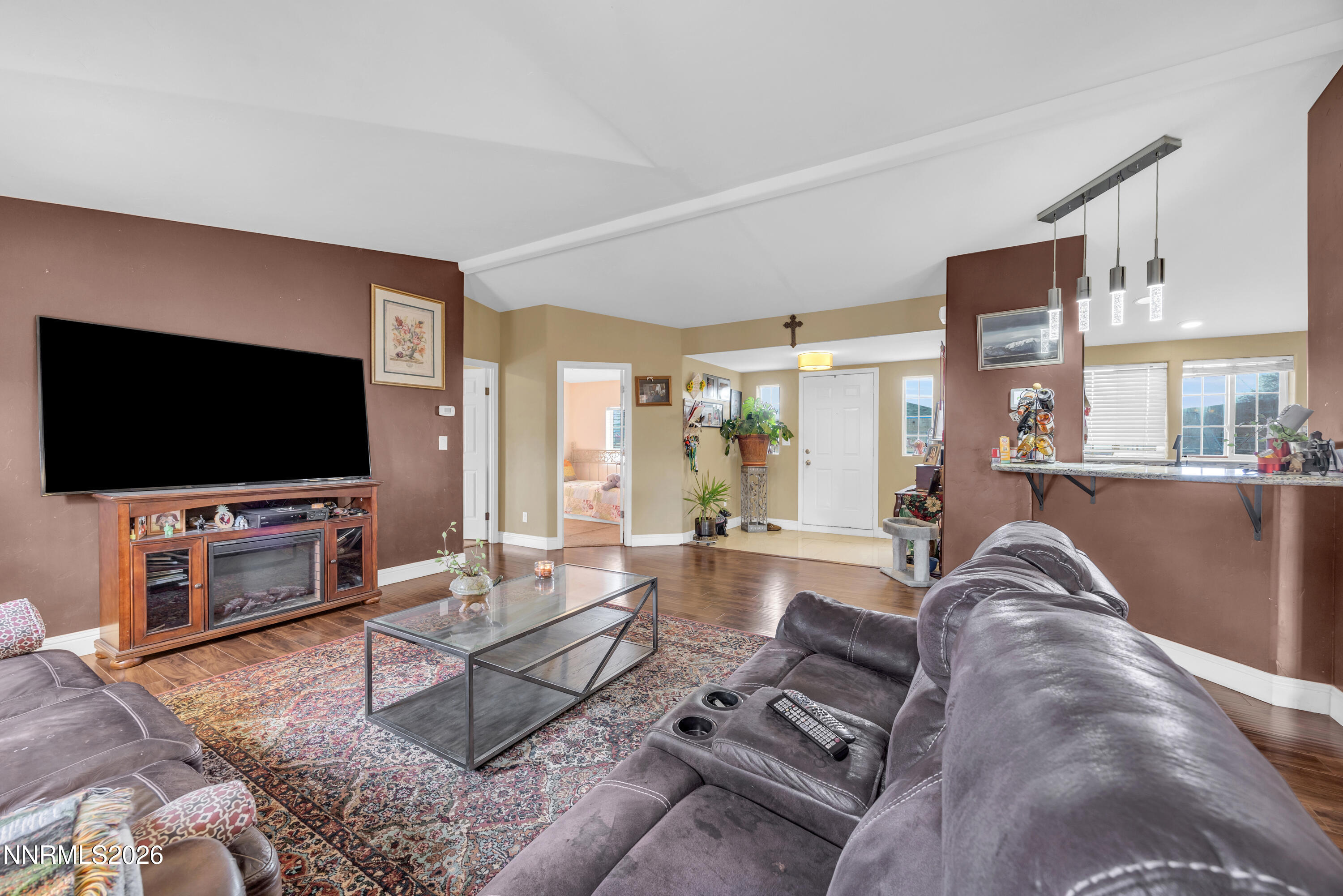 592 Morgan Circle Sun Valley, NV 89433 - Photo 5 of 24 a living room with furniture and a flat screen tv