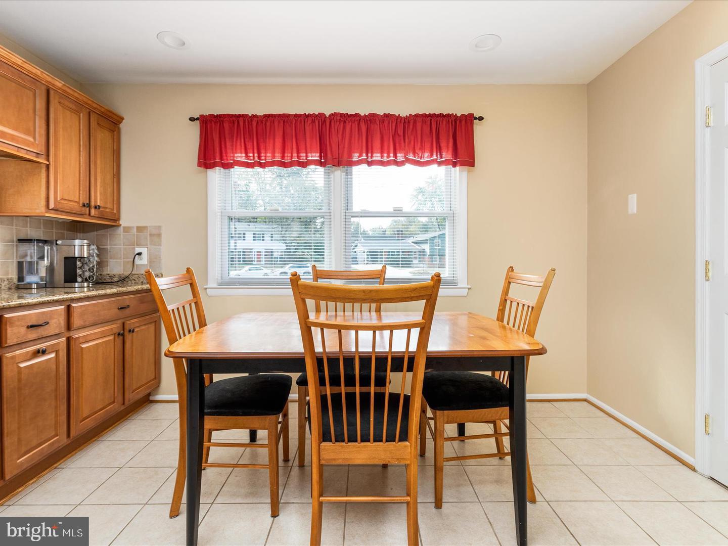 6434 Rives Court Springfield, VA 22150 - Photo 11 of 37 a view of a dining room with furniture window and outside view
