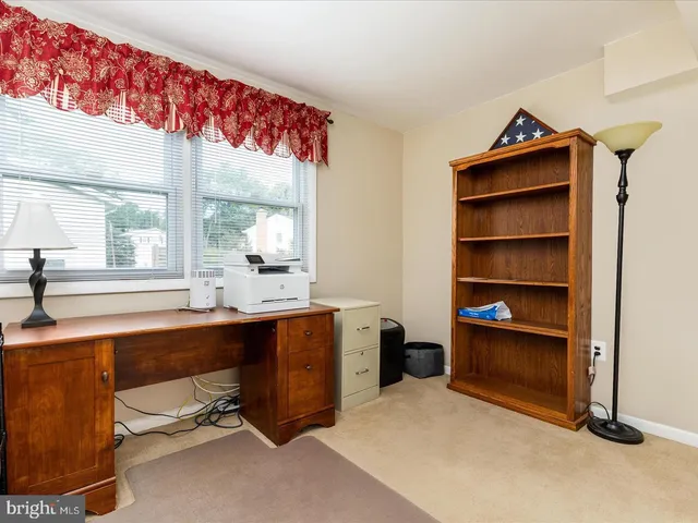 a view of workspace with a window and cabinet