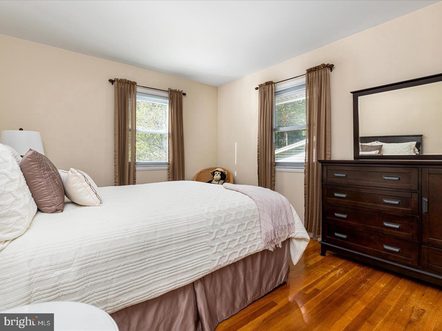 6434 Rives Court Springfield, VA 22150 - Photo 20 of 37 a bedroom with a bed and a dresser