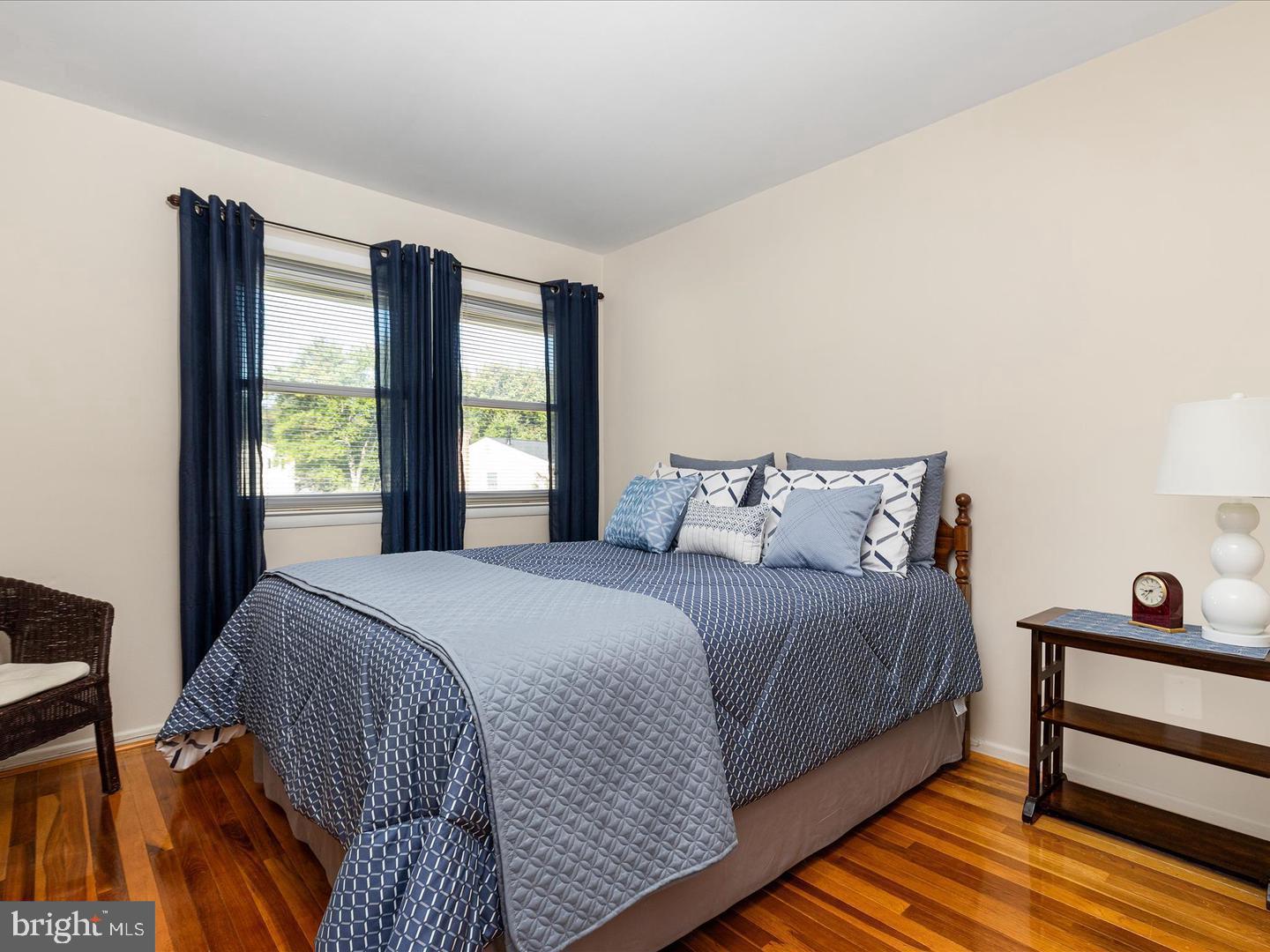 6434 Rives Court Springfield, VA 22150 - Photo 21 of 37 a bedroom with a bed and wooden floor
