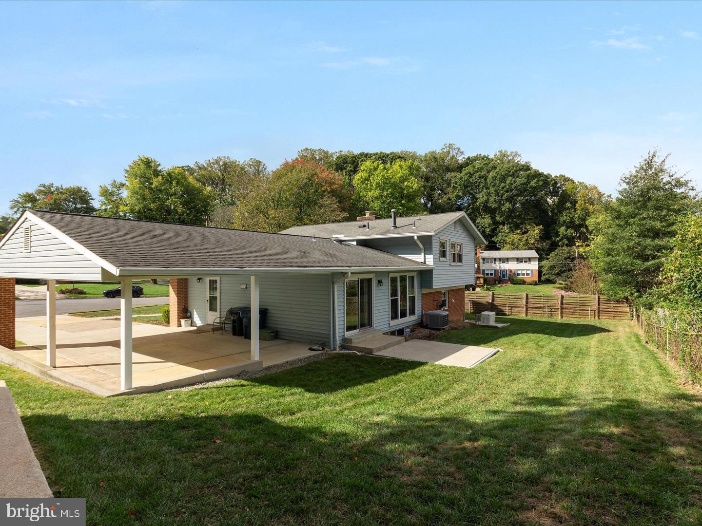 6434 Rives Court Springfield, VA 22150 - Photo 32 of 37 a view of a house with a yard porch and sitting area