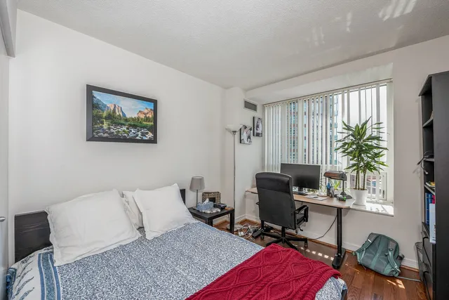 a livingroom with workspace and a couch