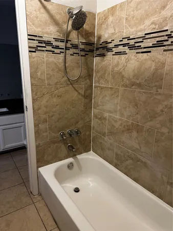 a bathroom with a sink and a shower