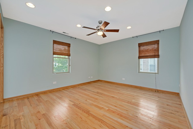 8013 West Irving Park Road Chicago, IL 60634 - Photo 13 of 25 wooden floor in an empty room with a window